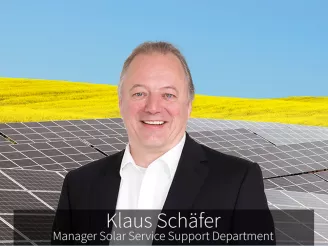 Klaus Schaefer Sharp Solar Service Manager in front of PV installation