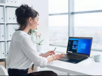 A woman working on a laptop