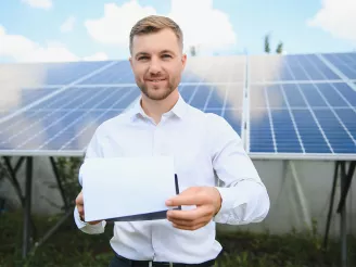 man taking notes on PV plant